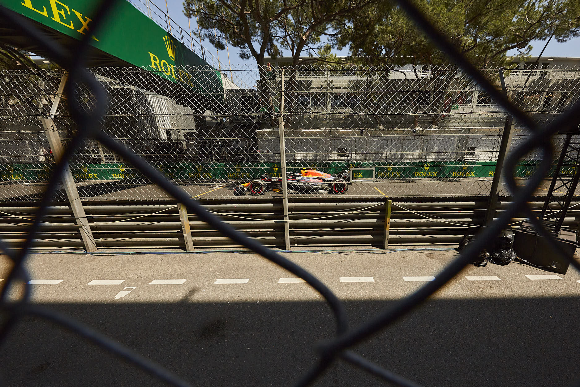 F1 car at high speed on the main straight near Anthony Noghes corner